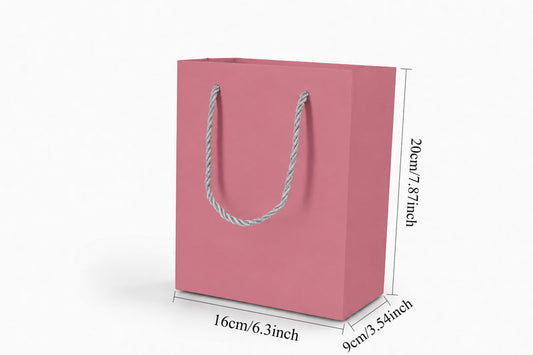 Front view of pink jewelry store gift tote bag with rope handles, 6.25 × 3.5 × 7.75 in