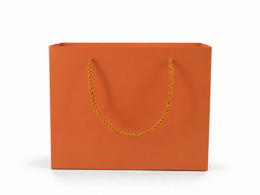 Front view of orange jewelry store gift tote bag with rope handles, 10.25 × 4.25 × 7.75 in
