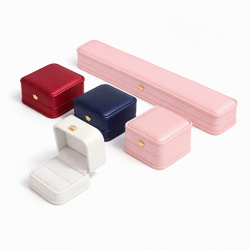 Assorted-color rounded jewelry presentation boxes for rings, pendants, necklaces, and bracelets from Jeweller Buy.