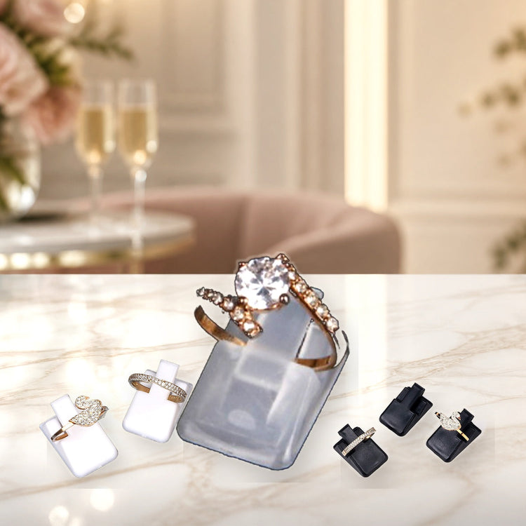 Custom ring display stands with detailed finishes on a bright engagement counter