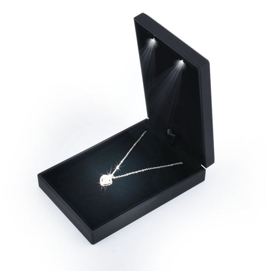 Open black LED light small necklace box displaying a pendant necklace
