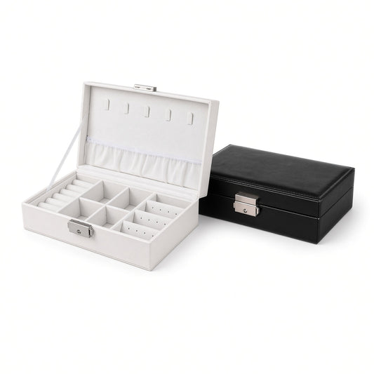 White open and black closed compact jewelry boxes with locks, showing the divided interior and stitched PU exterior
