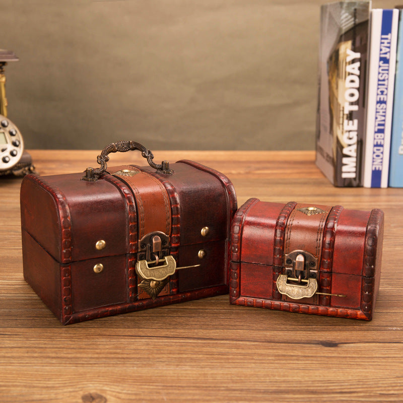 Large and small closed reddish brown wooden chests with brass locks