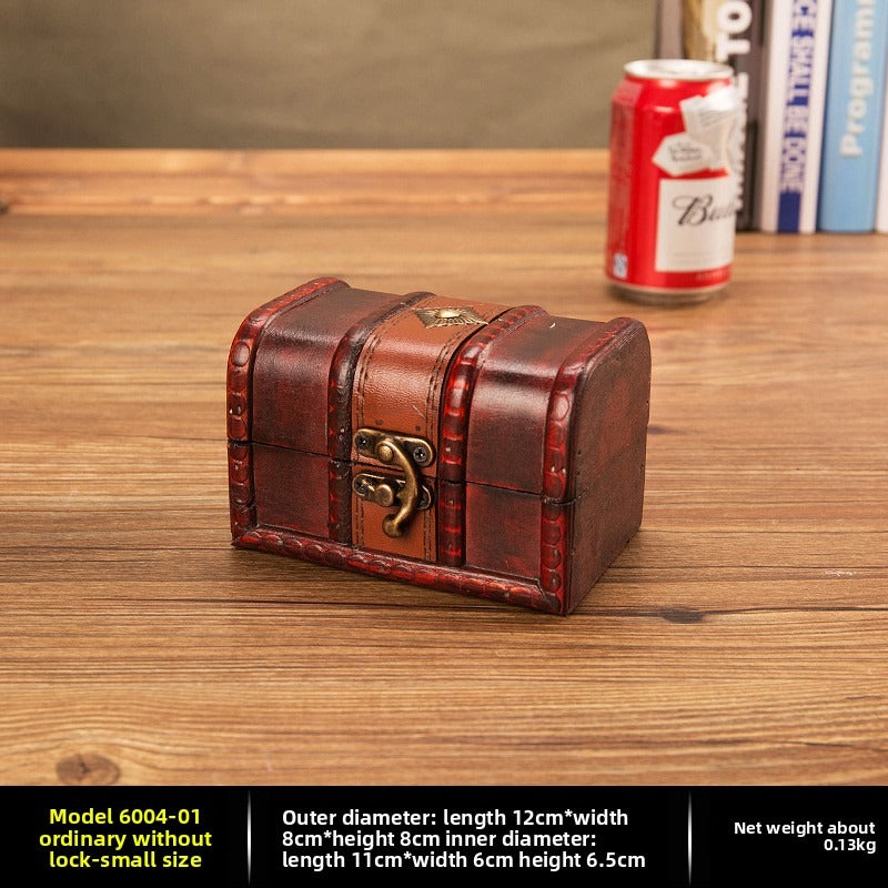 Small reddish brown wooden chest with curved brass latch