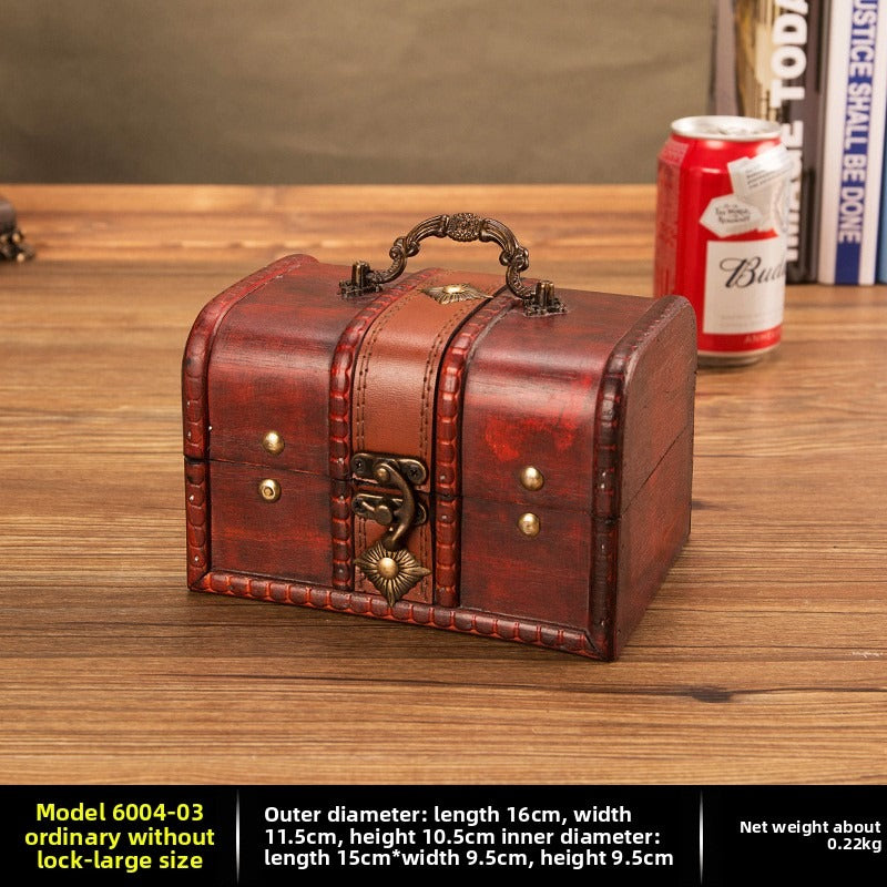Large reddish brown wooden chest with ornate handle and curved latch
