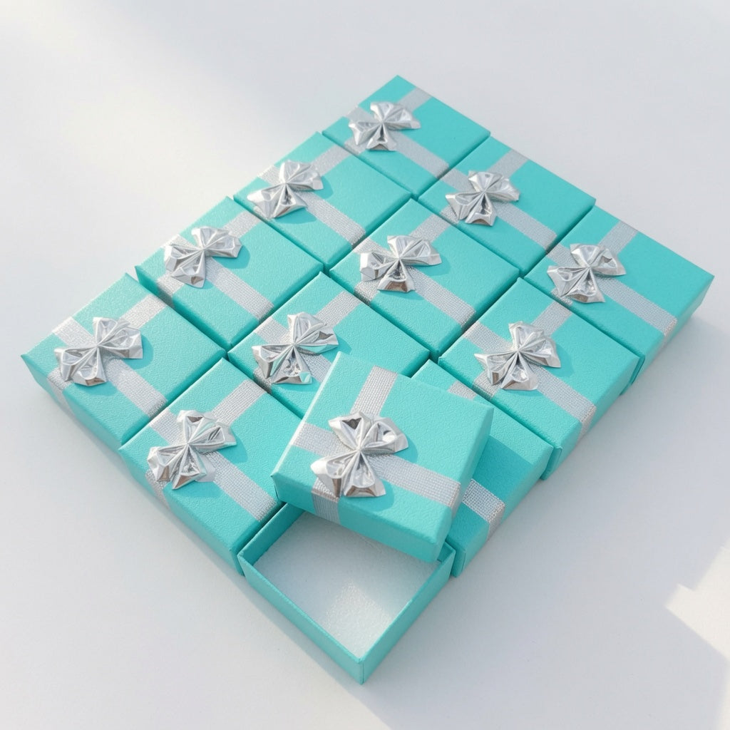 Lake blue paper ring boxes with silver ribbon bows in a wholesale set