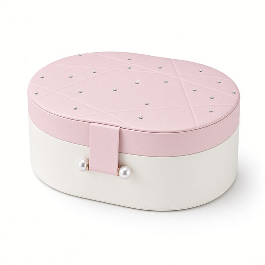 Pink and white oval jewelry case with rhinestone lid and pearl-style clasp