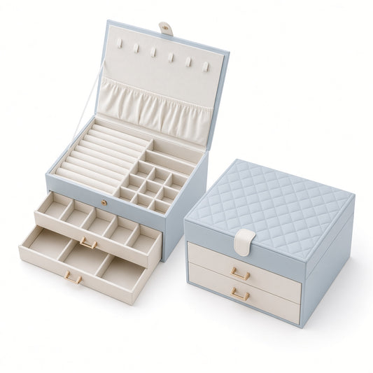 Quilted 3 layer jewelry box shown open with two drawers beside a closed matching case