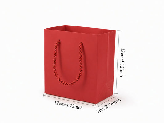 Front view of red jewelry store gift tote bag with rope handles, 4.75 × 2.75 × 5 in