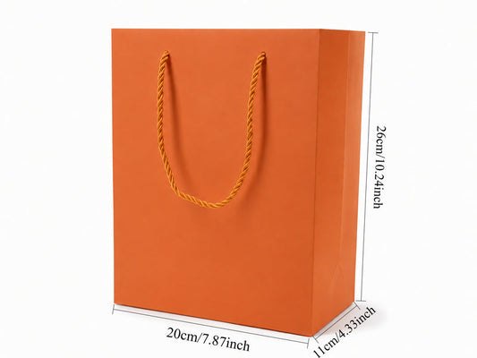 Front view of orange jewelry store gift tote bag with rope handles, 7.75 × 4.25 × 10.25 in