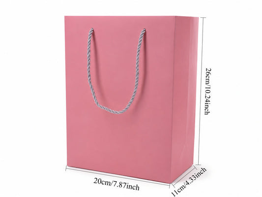 Front view of pink jewelry store gift tote bag with rope handles, 7.75 × 4.25 × 10.25 in
