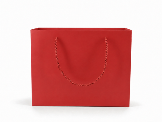 Front view of red jewelry store gift tote bag with rope handles, 10.25 × 4.25 × 7.75 in