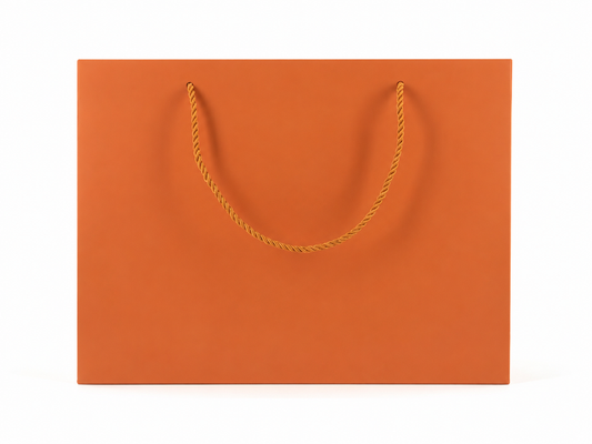 Front view of orange jewelry store gift tote bag with rope handles, 13 × 6 × 9.75 in