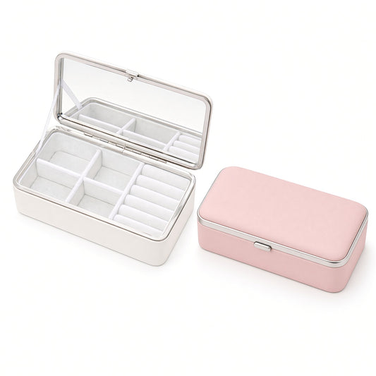 Travel jewelry box with open pearl white mirror style and closed pink box
